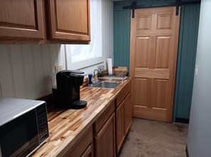 Fridge, microwave, coffee/tea maker, high chair