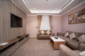 Apartment, 2 Bedrooms | Living area | 42-cm flat-screen TV with satellite channels, heated floors, offices
