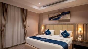 Apartment, 2 Bedrooms | Premium bedding, minibar, individually decorated, laptop workspace