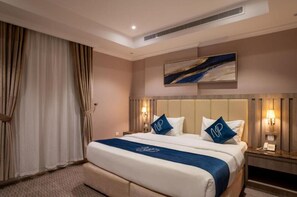 Apartment, 2 Bedrooms | Premium bedding, minibar, individually decorated, laptop workspace
