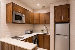 Apartment, 2 Bedrooms | Private kitchen | Microwave, stovetop, electric kettle, cookware/dishes/utensils - Nars Plus Serviced Apartments - Al Basateen (Jeddah)
