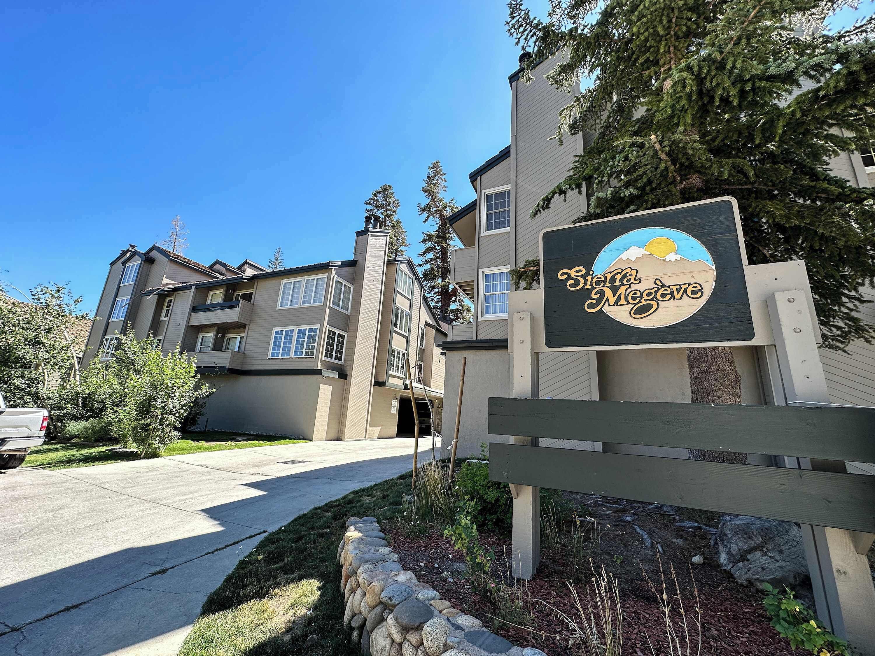 A multi-story building with a sign reading "Sierra Megeve."