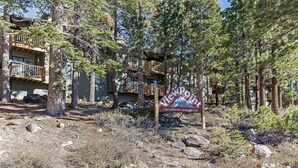 A Viewpoint property surrounded by trees and rocky terrain.