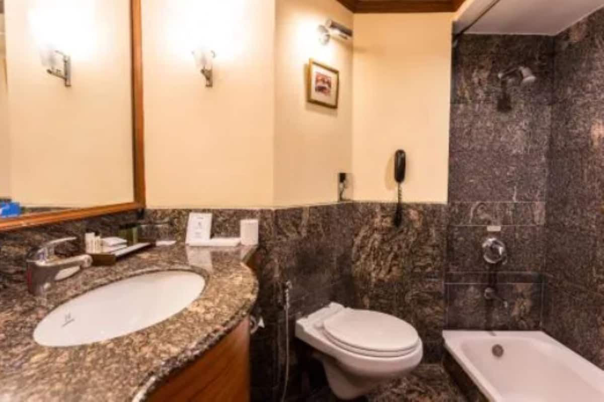Shower, rainfall showerhead, towels, soap