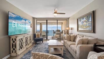 Premium Condo, 3 Bedrooms, Balcony, Beach View | Living room | 55-inch Smart TV with cable channels