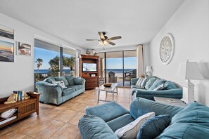 Signature Condo, 3 Bedrooms, Balcony, Beachfront | Living room | 55-inch Smart TV with cable channels - Bluewater Vacation Rentals (Orange Beach)