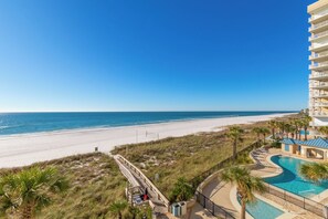 Enjoy ocean views from the comfort of your room or relax by the pool surrounded by palm trees.