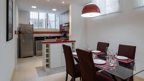 A modern kitchen with a dining area. - 4 Minutes From Copacabana Beach Nsc205 (Rio de Janeiro)