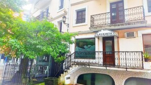 A building with a sign reading "LAVAXETANO" and balconies with wrought iron railings. - HOTEL LAUAXETA MUNGUIA (Mungia)