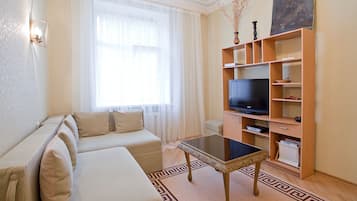 Apartment, City View | Living area | 39-inch LCD TV with cable channels