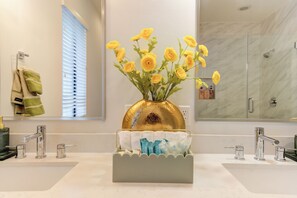Shower, hair dryer, towels, soap