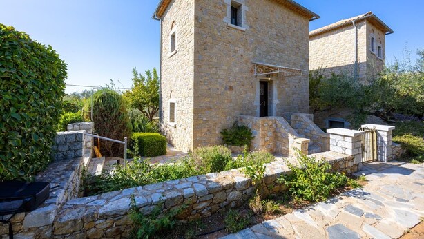A stone building with a small entrance and a staircase leading up to it. - Panorama II Villas - Two Bedroom Villa, Sleeps 7 (Ditiki Mani)