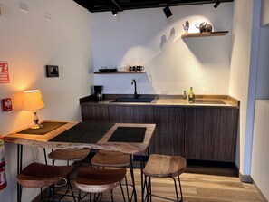 Full-sized fridge, microwave, cookware/dishes/utensils