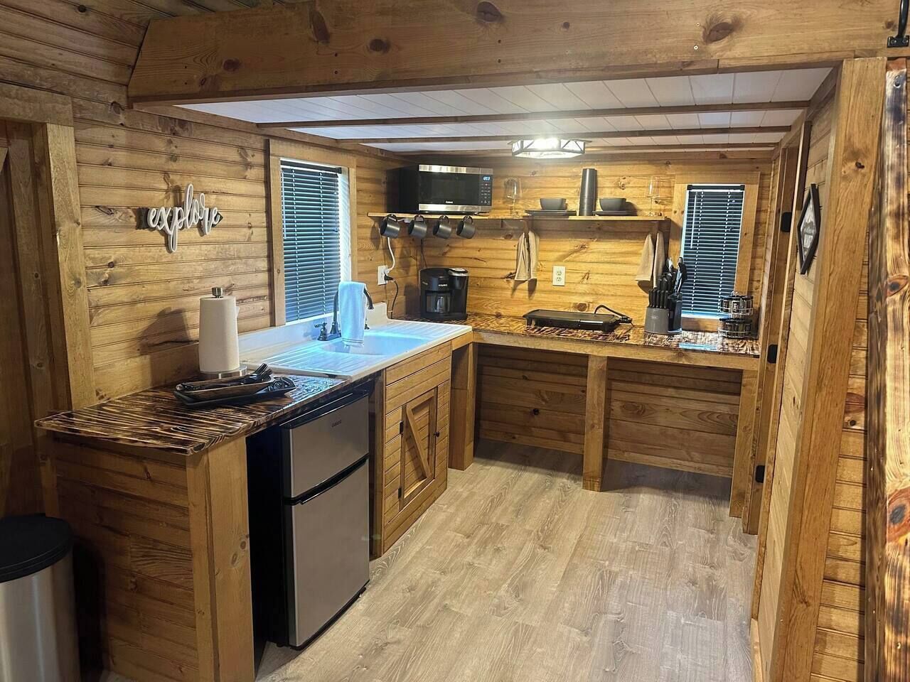 Fridge, microwave, coffee/tea maker, cookware/dishes/utensils