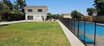 Spacious 2 story gated home w/ pool & play area.