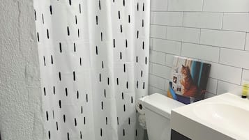 Shower, hair dryer, towels, shampoo