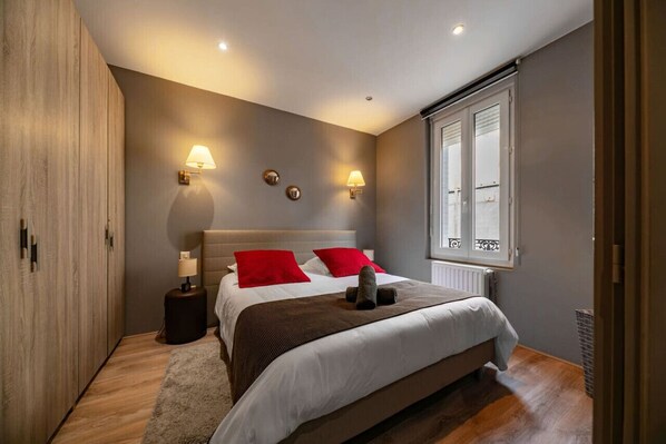 1 bedroom, desk, iron/ironing board, travel crib