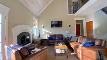 Een smart-tv, boeken, een kantoor en een printer