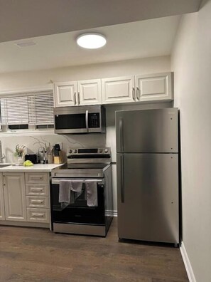 Comfort Apartment, Patio | Private kitchen | Coffee/tea maker, cleaning supplies, freezer