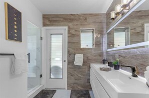 Shower, hair dryer, towels, soap