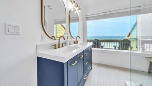 A bathroom with a dual vanity, large mirrors, and a view of the ocean. - Sea Destin - Private BeachFront Townhouse (Destin)