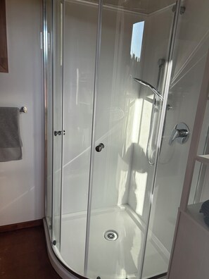 Shower, towels, soap, toilet paper