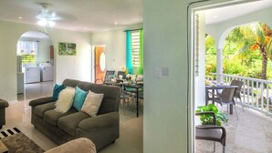 Una sala de estar con un sofá, un comedor con mesa y sillas, y vistas a un balcón con plantas.
