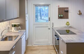 Fridge, stovetop, dishwasher, coffee/tea maker