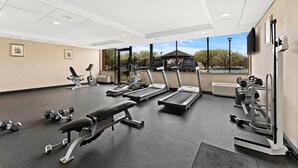 A gym with treadmills, dumbbells, and weight machines. - Quality Hotel Philadelphia Airport (Essington)