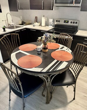 Enjoy cooking in this well-equipped kitchen with a central island and stainless steel appliances.