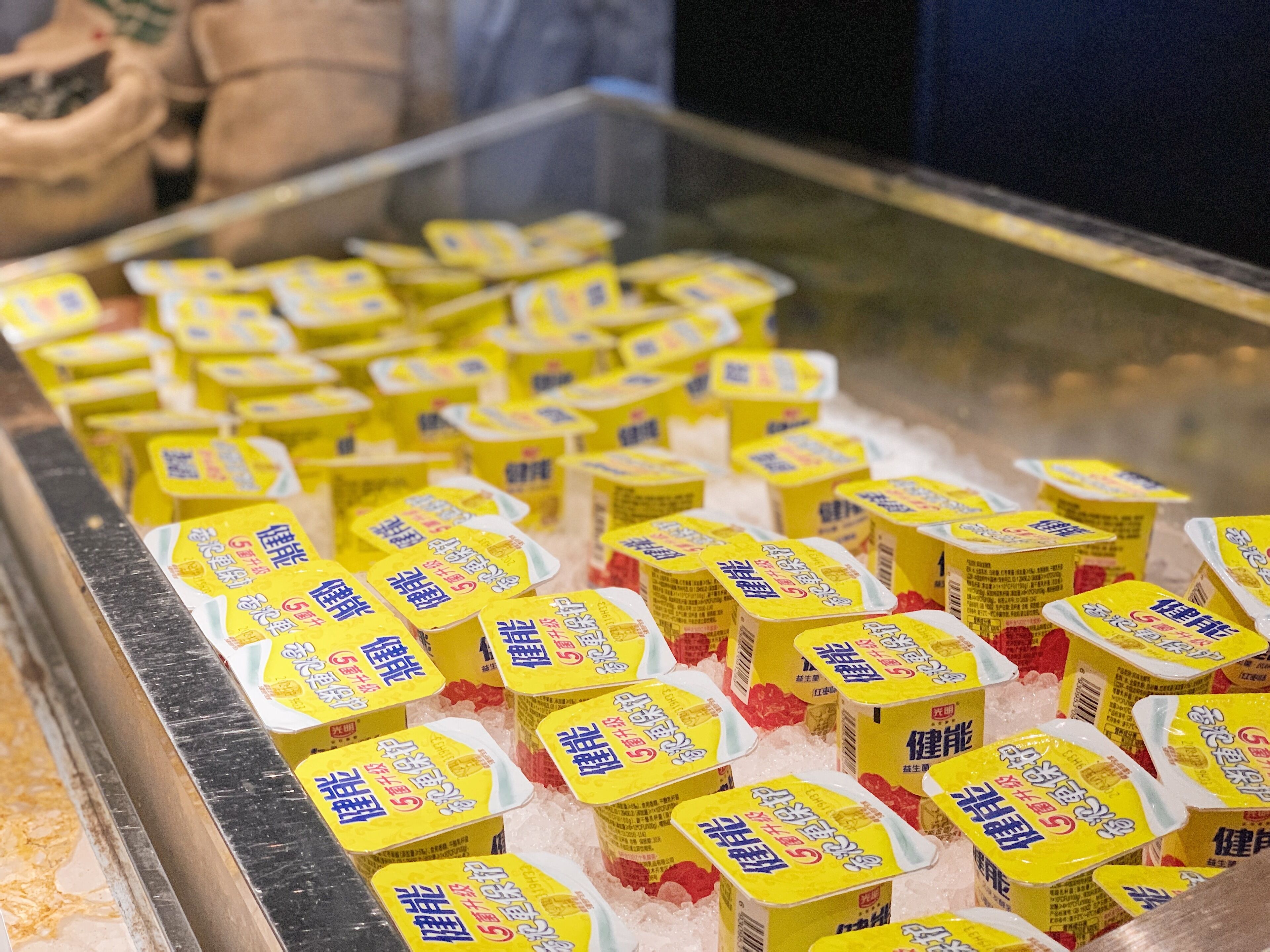 A display of packaged food items in a refrigerated section.