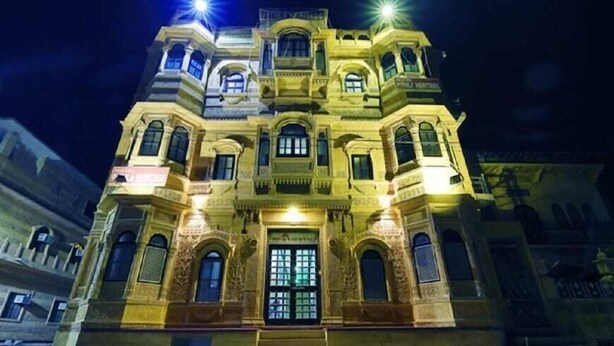 A multi-story building with ornate architectural details and a prominent entrance. - Hotel Regal Heritage Jaisalmer (Jaisalmer)