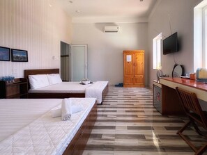 Superior Quadruple Room, City View | Free minibar items, desk, laptop workspace, soundproofing - Chan Hotel Phu Quy (Phu Quy)