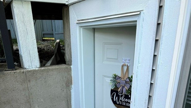 A white door with a welcome sign and a small porch area. - Private 2 bedroom basement suite in Langley (Langley)
