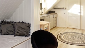 A compact kitchen with a sink, cabinets, and a countertop. - 4 Person Holiday Home in Oksvoll (Orland)