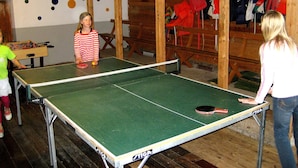 A ping pong table in a room with wooden walls and a foosball table. - Perfect House for Groups, Many Facilities, 14 Miles From Skiarea Branas (Sysslebäck)