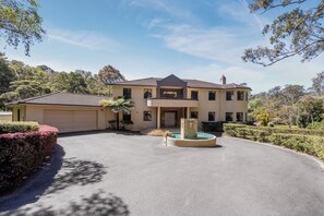 A two-story house with a garage, a swimming pool, and a well-maintained garden. - The Valley Way Luxury Estate (Mardi)