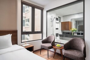 Family Triple Room, Balcony, City View | In-room safe, desk, laptop workspace, iron/ironing board - Marina Hotel (Bac Giang)