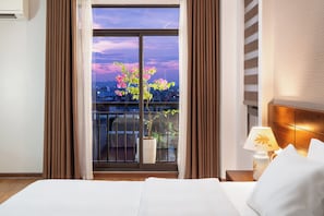 Deluxe Double Room, City View | In-room safe, desk, laptop workspace, iron/ironing board