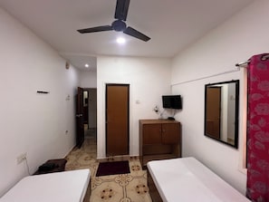 Economy Double or Twin Room | Desk, blackout curtains, iron/ironing board, bed sheets - hotel safra (Chennai)