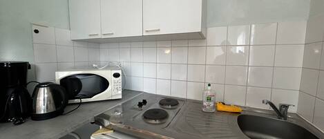 Microwave, stovetop, coffee/tea maker, toaster