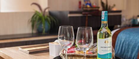 A bottle of Jacob's Creek Sauvignon Blanc on a tray with two glasses.
