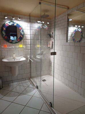 Shower, hair dryer, towels, soap