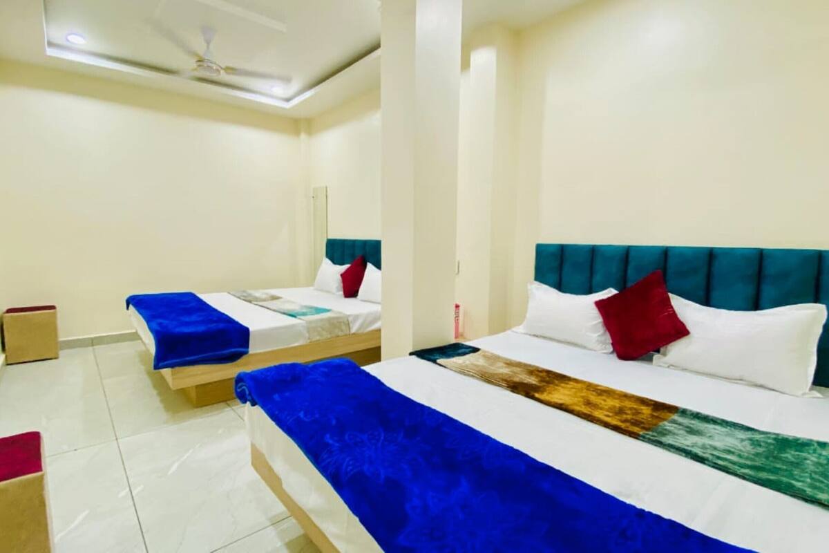 Deluxe Quadruple Room, City View | WiFi (free), bed sheets