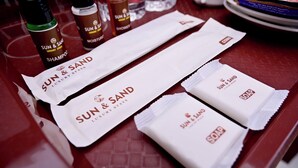 A table with toiletries including shampoo, shower gel, and soap. - Sun & Sand Luxury Stays Sea View (Bhatkal)
