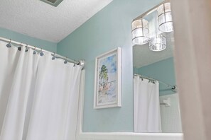 Shower, hair dryer, towels, shampoo
