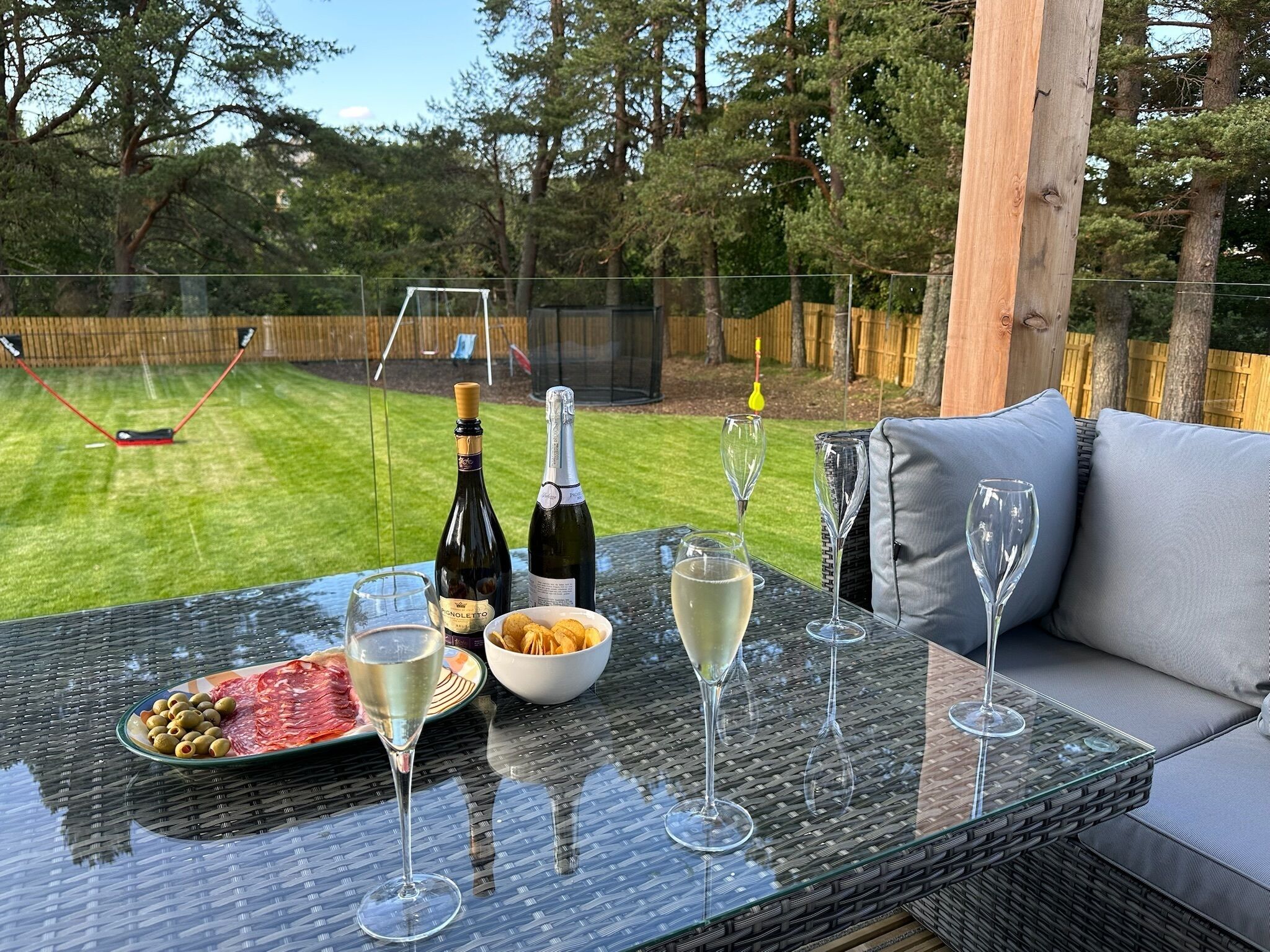 Relaxing outdoor deck area, overlooking kids play area. 