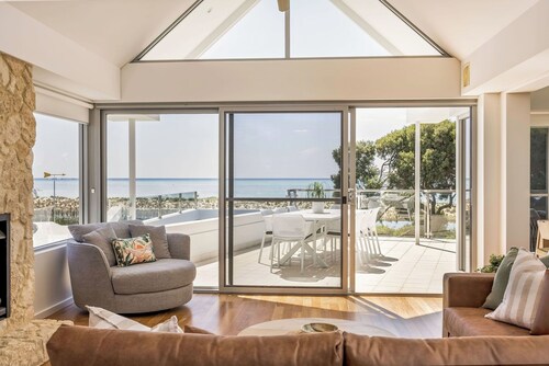 ULTIMATE BEACHFRONT ESCAPE SITUATED OPPOSITE SERENE WATERS OF GEOGRAPHE BAY.