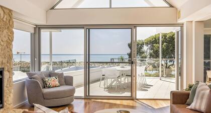 ULTIMATE BEACHFRONT ESCAPE SITUATED OPPOSITE SERENE WATERS OF GEOGRAPHE BAY.