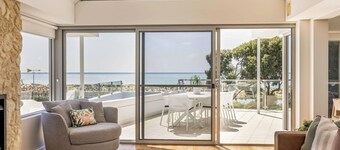 ULTIMATE BEACHFRONT ESCAPE SITUATED OPPOSITE SERENE WATERS OF GEOGRAPHE BAY.